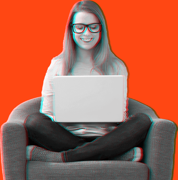 Smiling woman with laptop sitting cross-legged in chair.